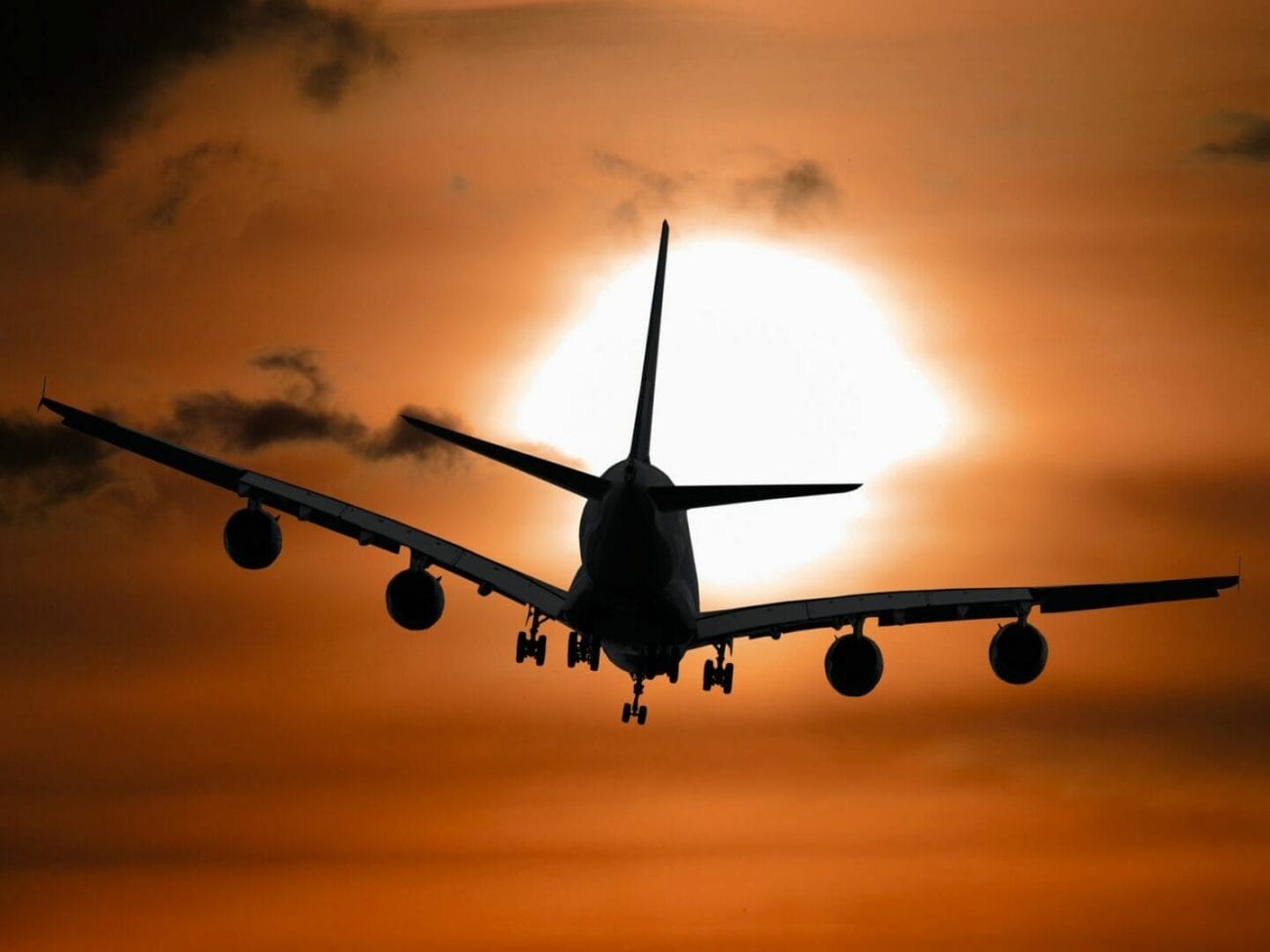 shadow image of a plane flying during sunset - Book Cheap Flights for Europe