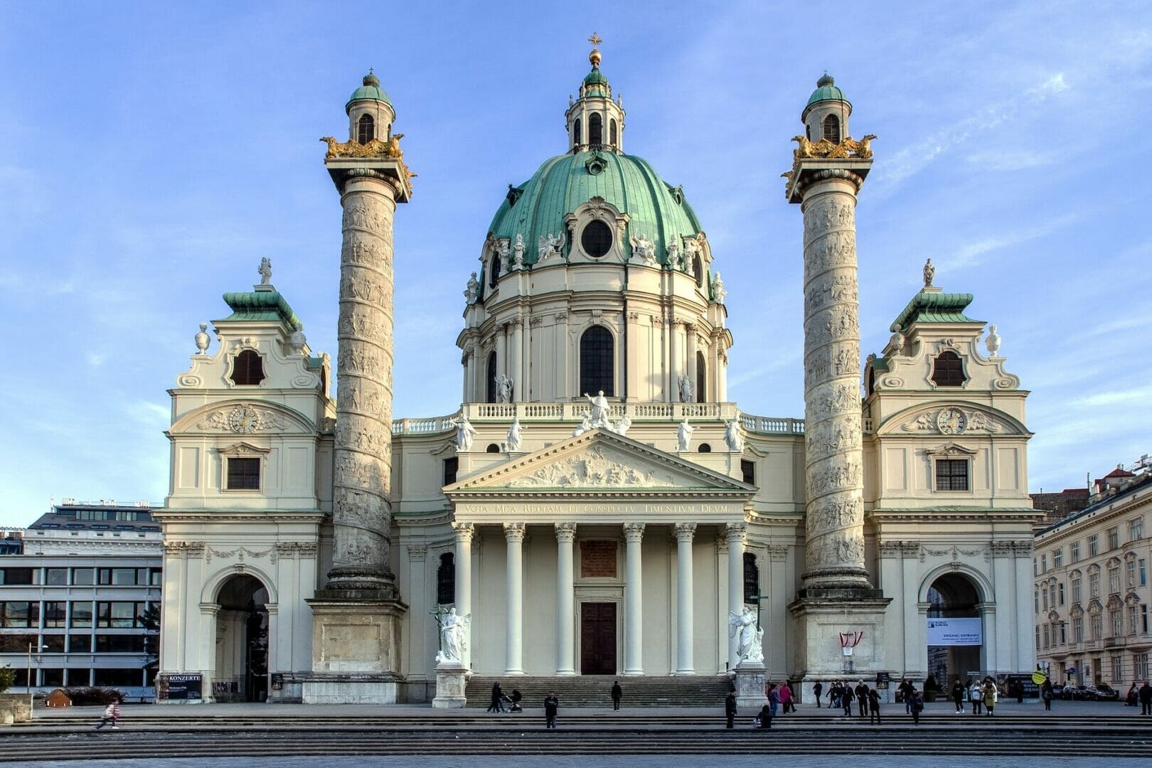 white concrete churchpeople under blue sky - Best Place in Europe to visit in February