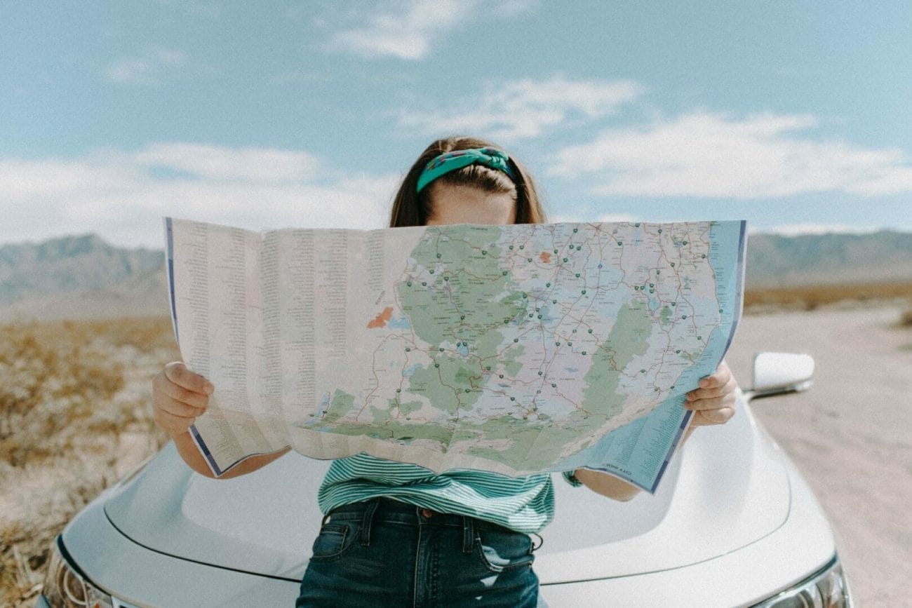 woman looking at the map - Best Travel Gifts