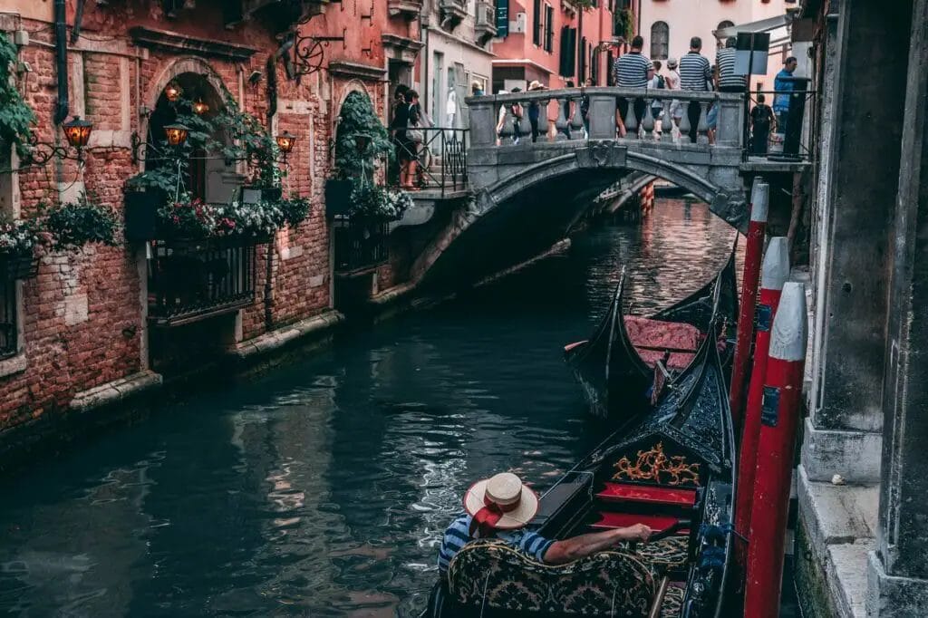 photo of man riding canoe - Venice City Pass Review -
