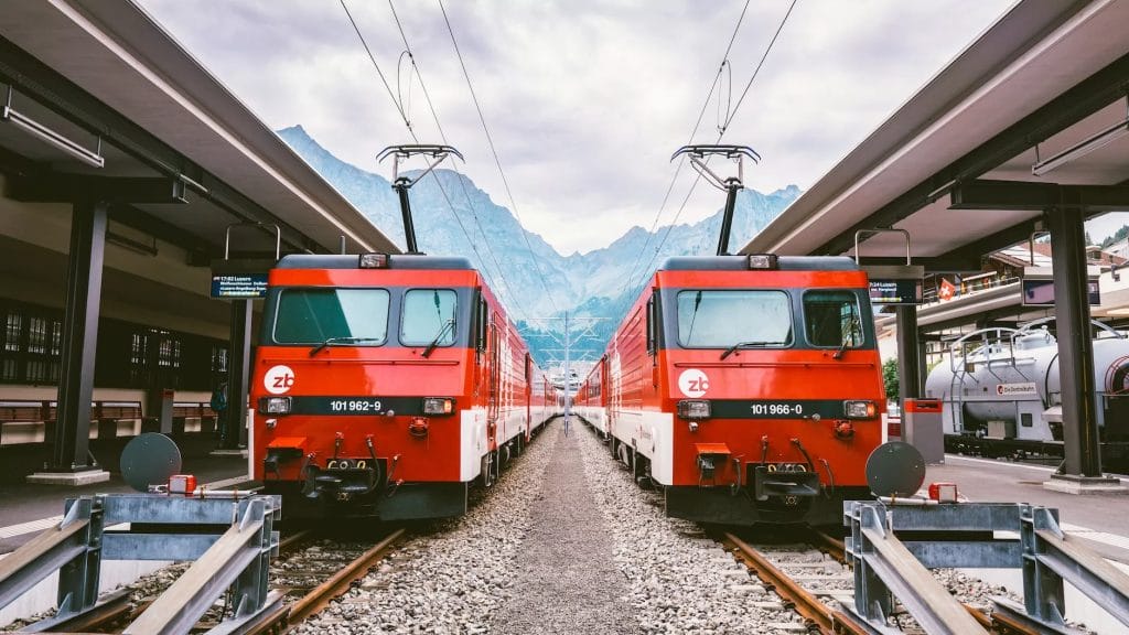 photo of two red trains