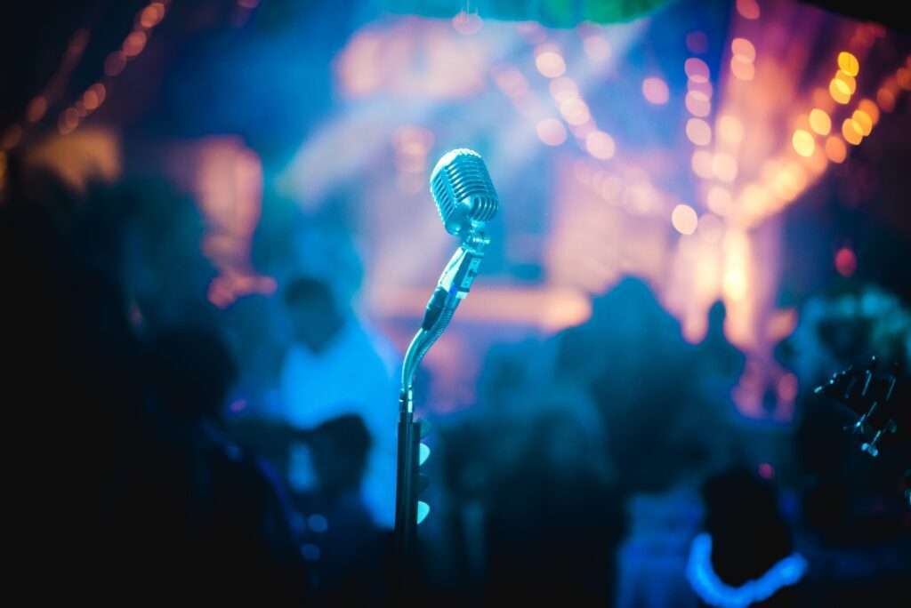 gray microphone inside party room - best karaoke bars in barcelona