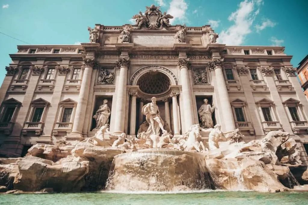 brown concrete house - Easter in Italy - Picture of Rome Trevi Fountain