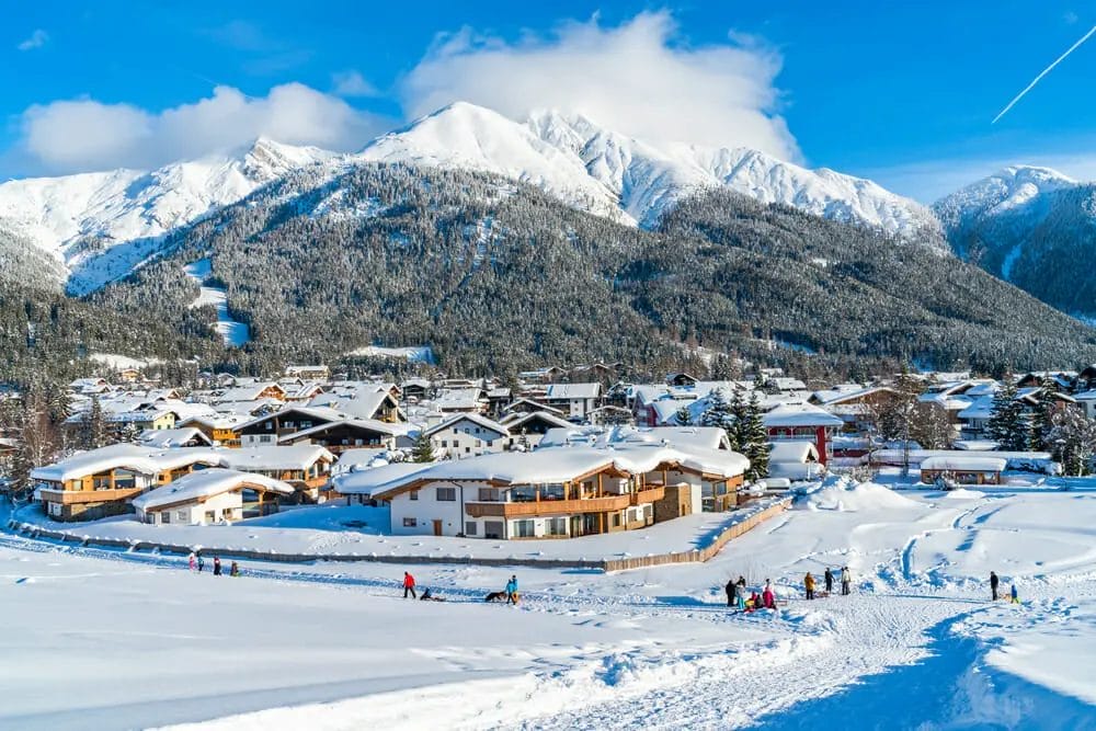 One Day in Innsbruck Itinerary The mountains in Innsbruck Austria are covered in snow.