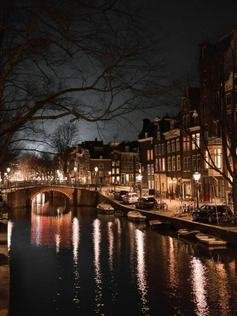 Old town street and canal at night