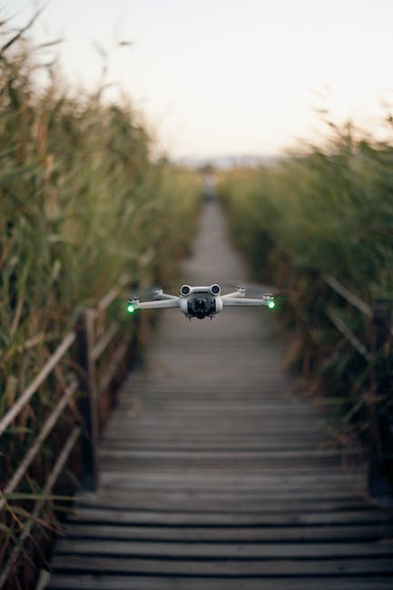 A drone flying over a wooden walkway.