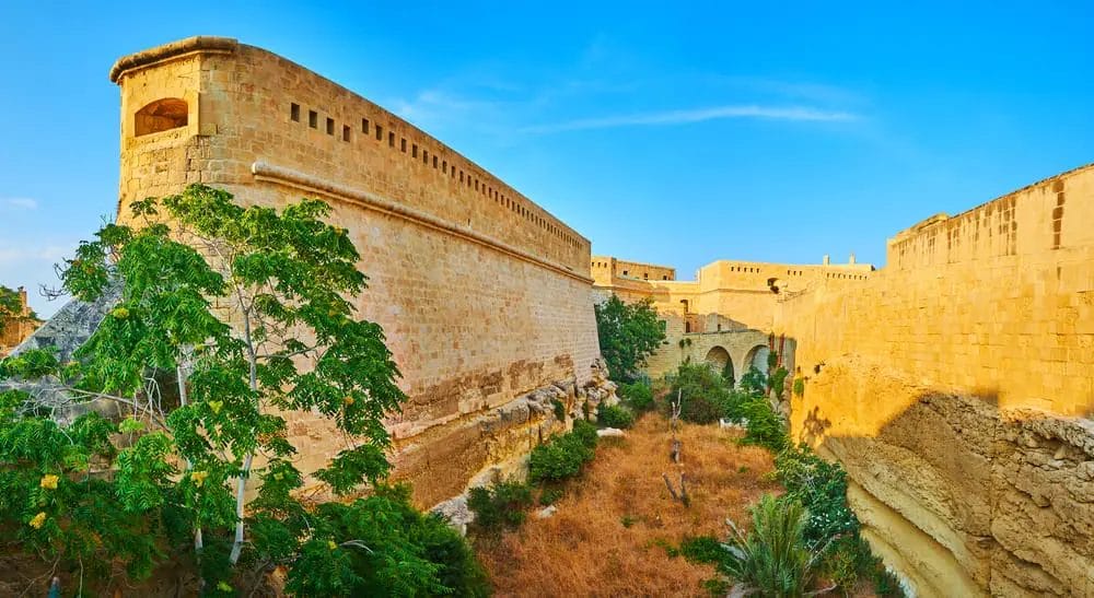 Enjoy the best view of a stone wall in Valletta, one of the must-visit tourist spots in Malta.