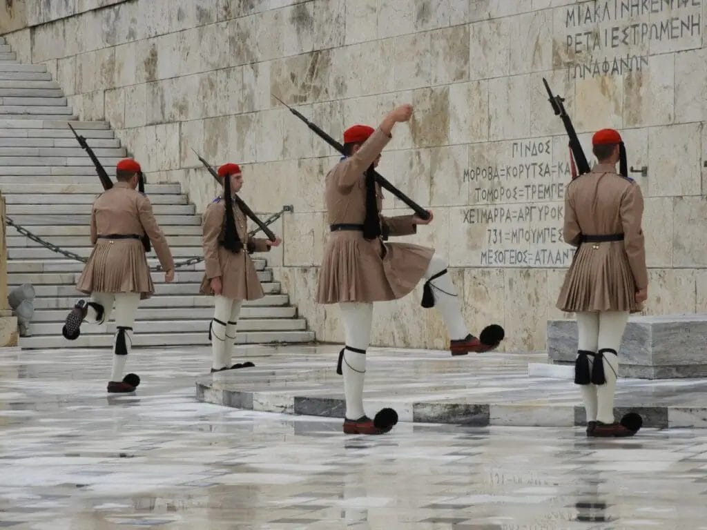 Among the top attractions in Athens, one can find a group of soldiers.