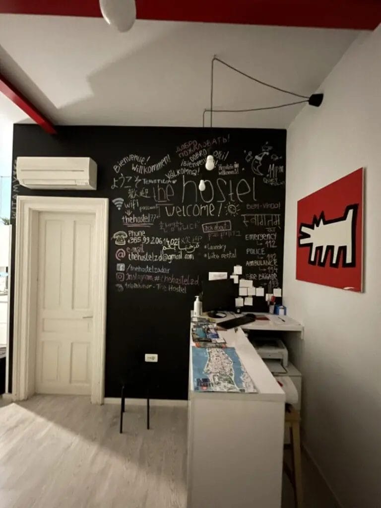 A small office with a chalkboard on the wall.