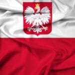 The flag of Poland, representing the national identity, proudly flutters in the wind.