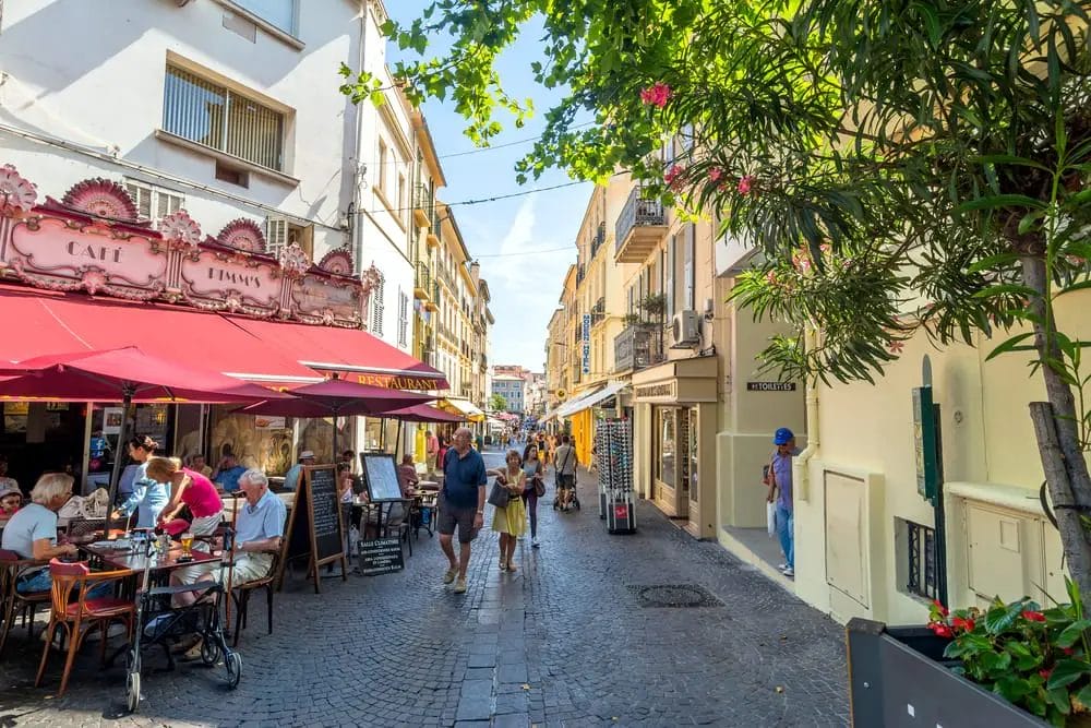 A red awning adorns a building in Antibes, adding a vibrant touch to the city's charm.