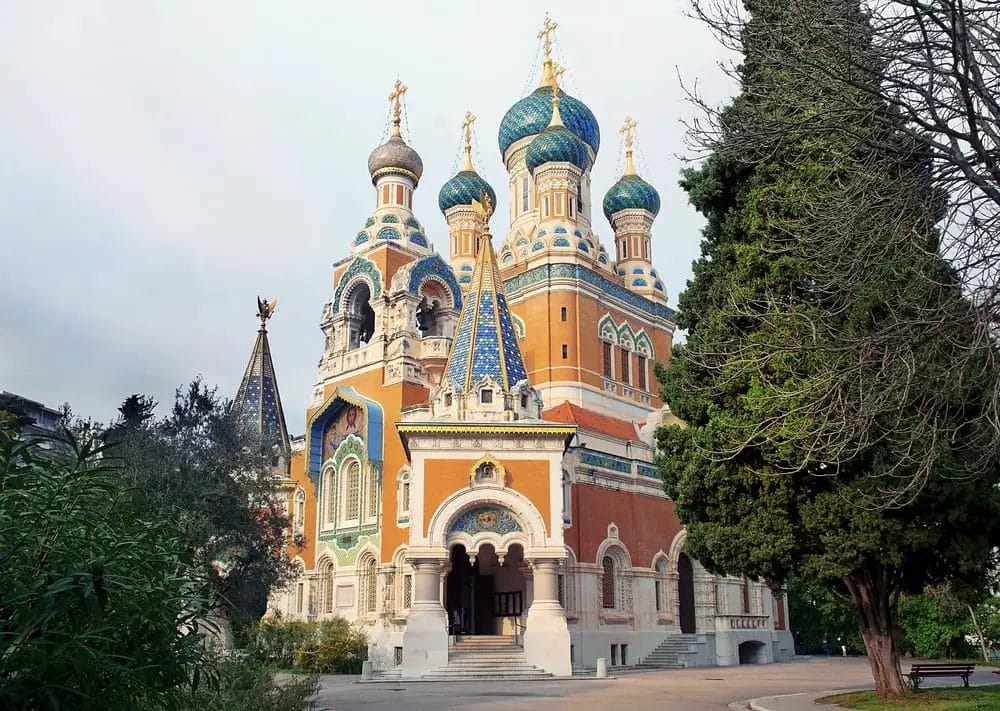 An ornate church with blue and gold domes.
