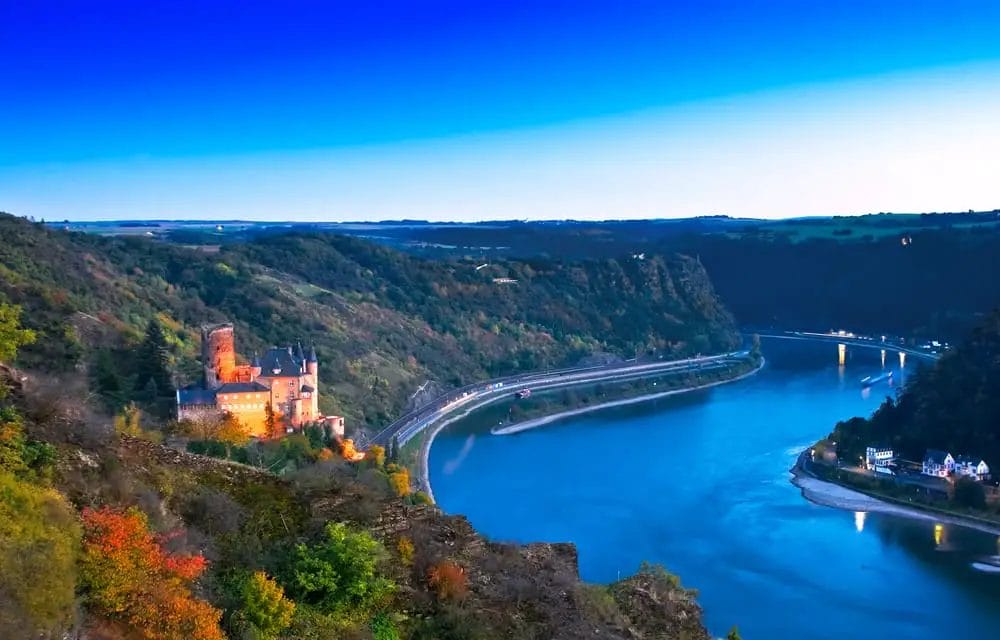 A castle on a cliff overlooking a river, perfect for weekend trips from Frankfurt.